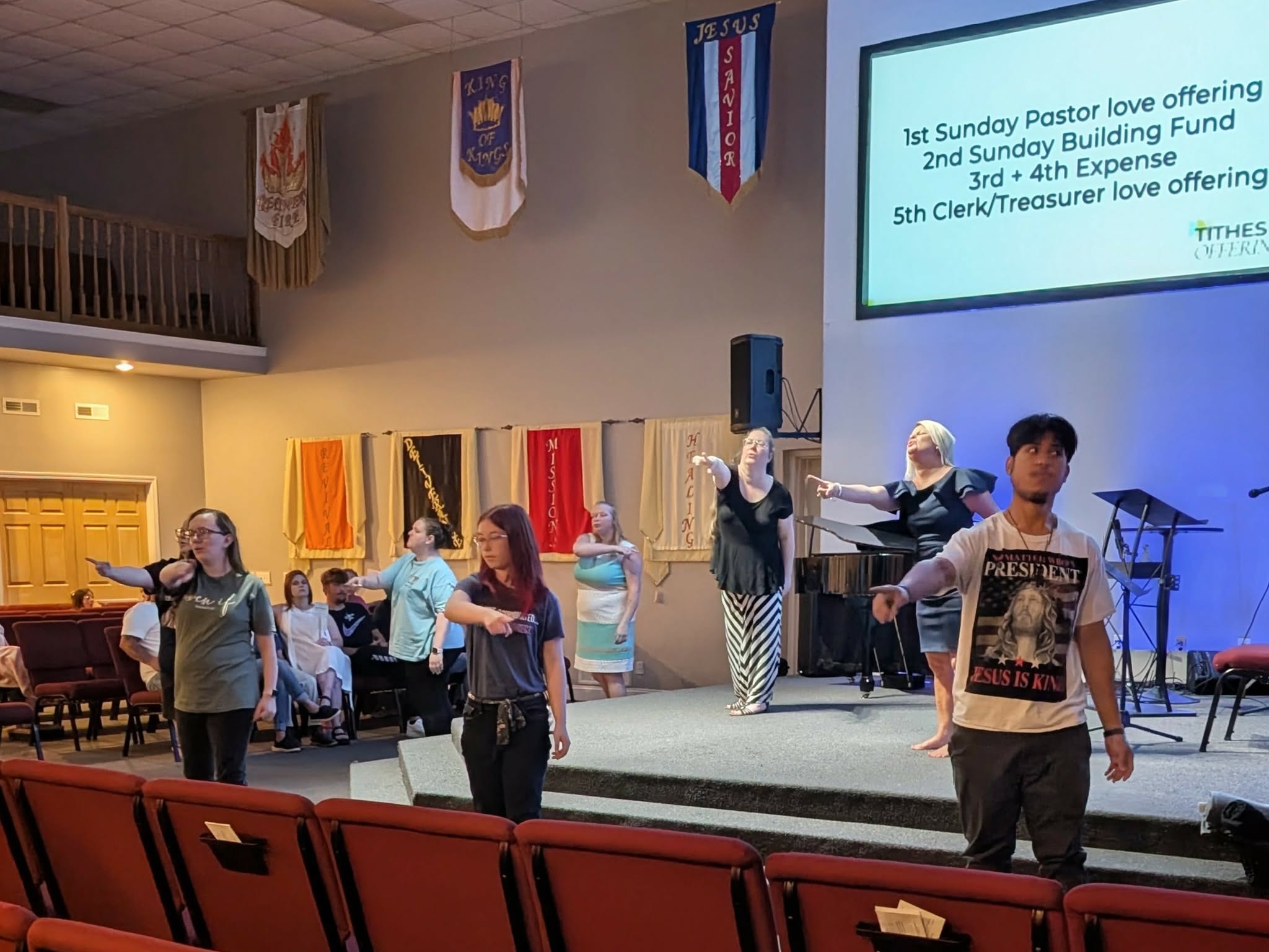Congregation in worship — hands raised