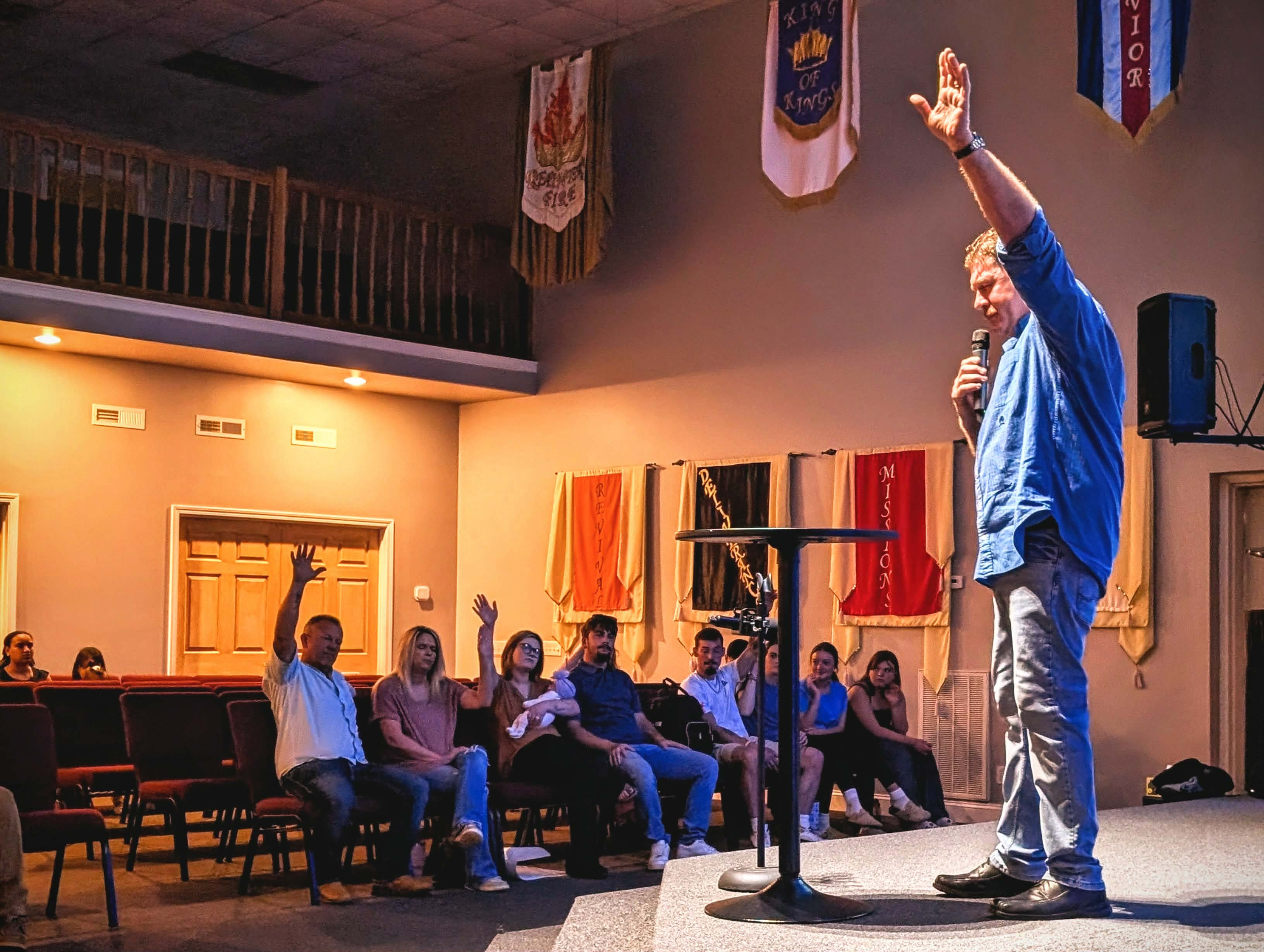 Pastor leading the congregation in prayer